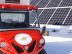 An Alke electric vehicle near the solar panels used for recharge the batteries