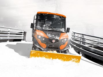 Vehicle with snow-blade