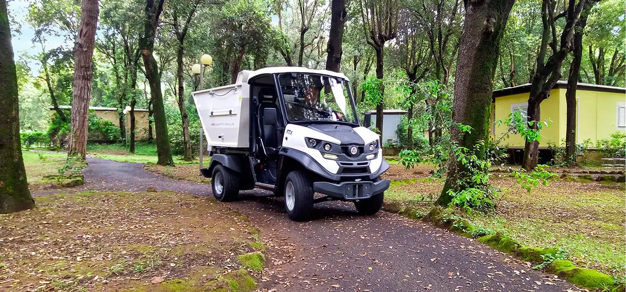 Waste collection vehicle in zoo park
